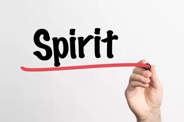 Human hand writing Spirit on whiteboard