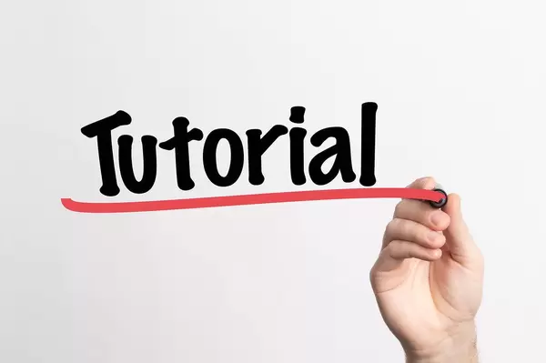 Human hand writing Tutorial on whiteboard