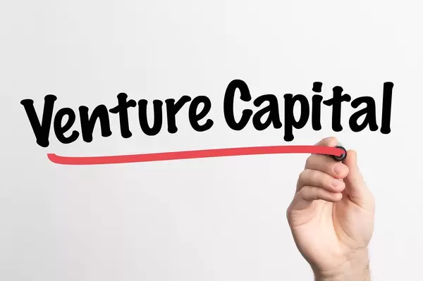 Human hand writing Venture Capital on whiteboard
