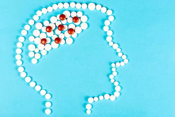 Human head with brains made from pills