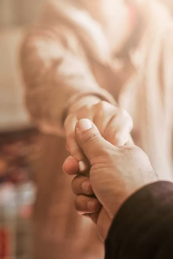 Husband holding his wife's hand