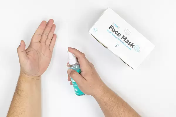 Hygiene of the hands and box with face masks