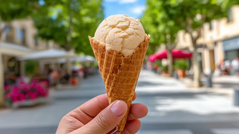 Ice cream cone hand holding summer dessert street