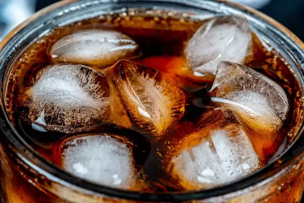 Ice cubes in a glass of Pepsi, close-up