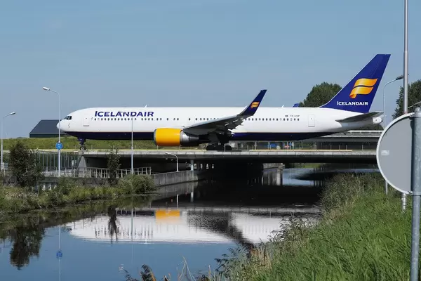 Icelandair plane taxiing on the bridge at Amsterdam Airport, bridge over water