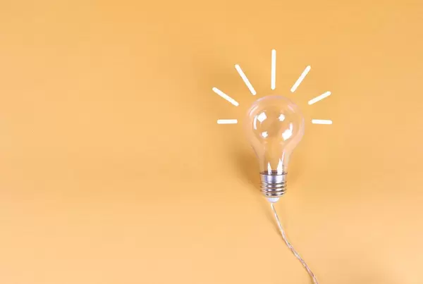 Idea light bulb on a orange background