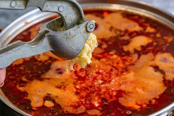 In a pot of borscht crushed garlic garlic cloves