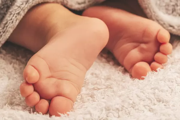 Infant's small feet close up