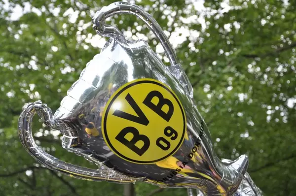 Inflatable Champions League Trophy with Borussia Dortmund Logo raised in the Air