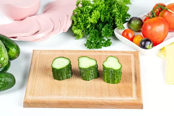 Ingredients for making appetizer rolls with vegetables, sausage and cheese