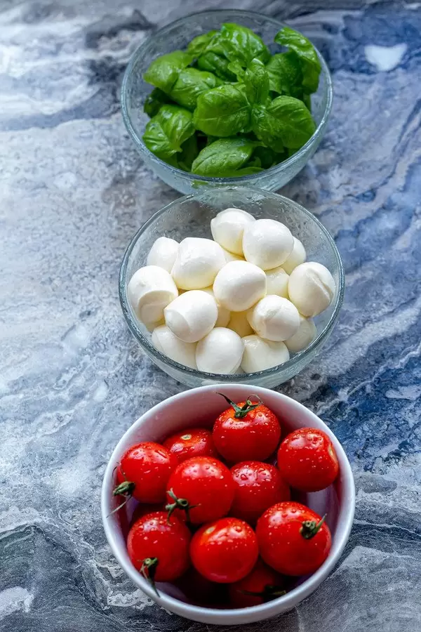 Ingredients for making Caprese salad on a grey background (Flip 2019) (Flip 2019)