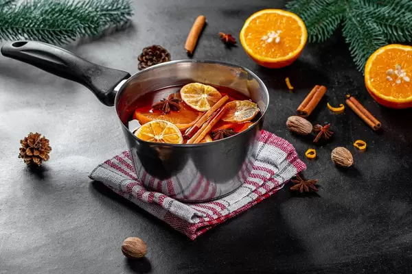 Ingredients for making mulled wine on a black background