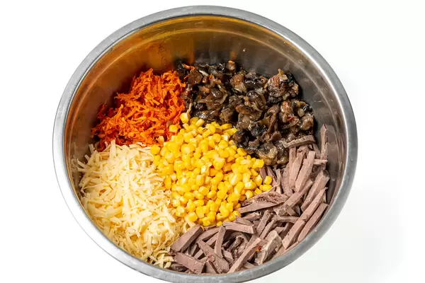 Ingredients in a metal pot for making salad with heart