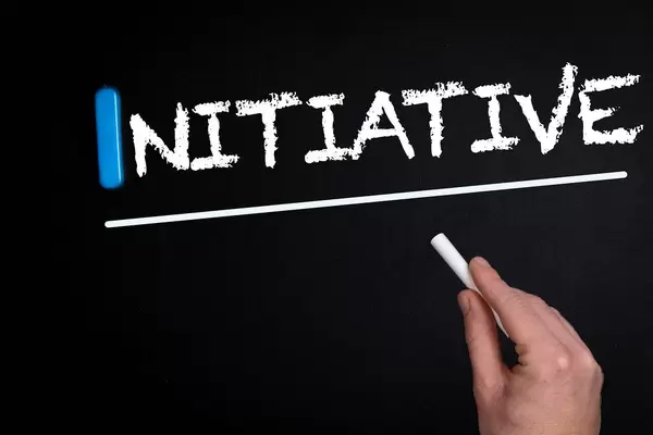 Initiative text on blackboard
