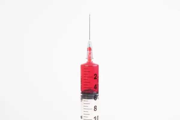 Injection needle on white background