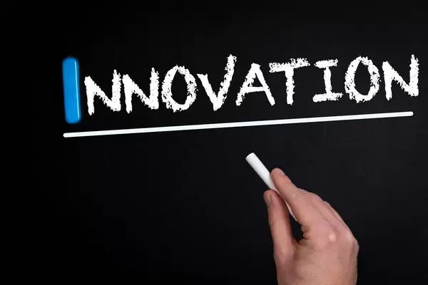 Innovation text on blackboard