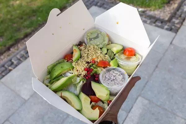 INSALATA QUINOA AVOCADO from L'Osteria is a mixed salad, quinoa, beetroot, avocado, pomegranate seeds, chia seeds and dressing