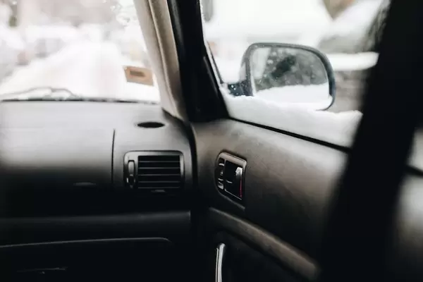 Inside view of a car. Focus on the door.