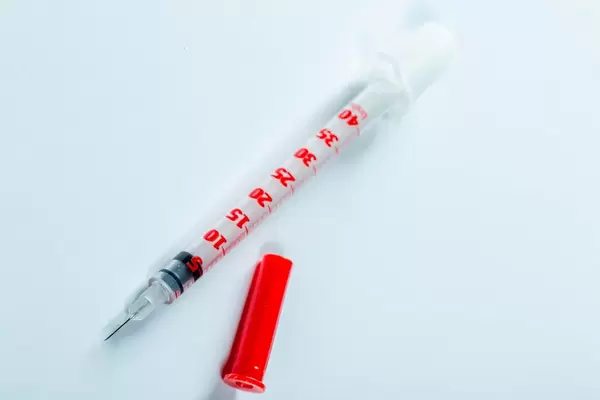 Insulin injection syringe on white background