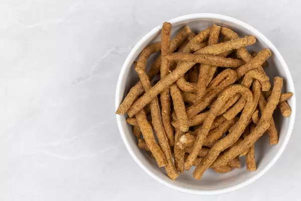 Integrated flour snacks in the bowl with copy space