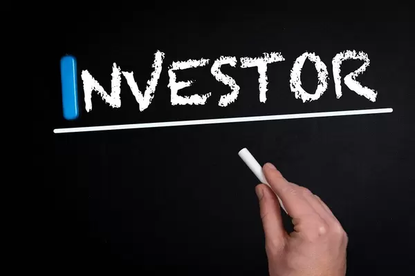Investor text on blackboard