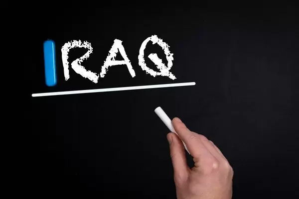 Iraq text on blackboard