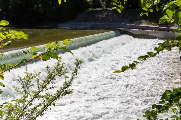 Isar at the Maximiliansanlagen in Munich in the south of Germany on a sunny summer day