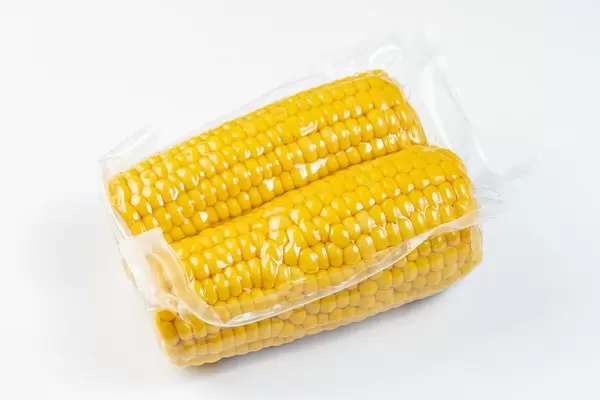 Isolated Cooked Young Corn on the white background (Flip 2019)