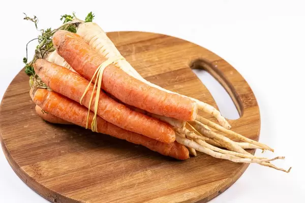 Isolated cutting board with Raw Soup Vegetables