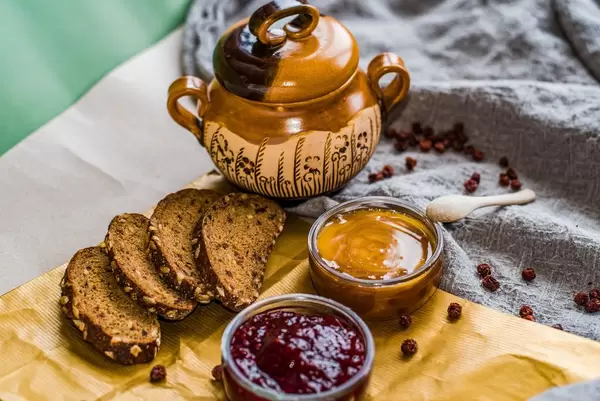 Jam And Honey Pot With Dark Bread