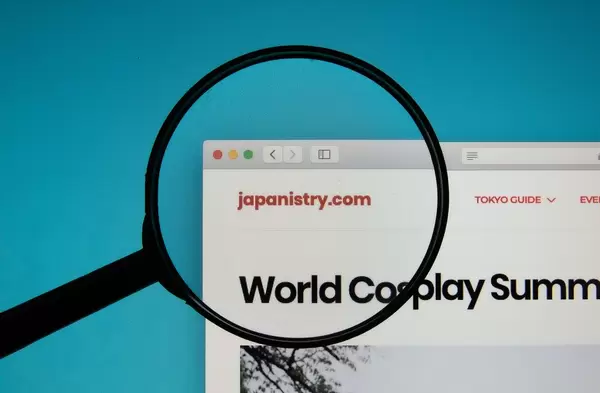 Japanistry website on a computer screen with a magnifying glass
