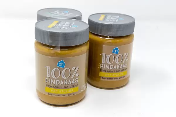 Jars of pure pindakaas, peanut butter in Dutch, with pieces