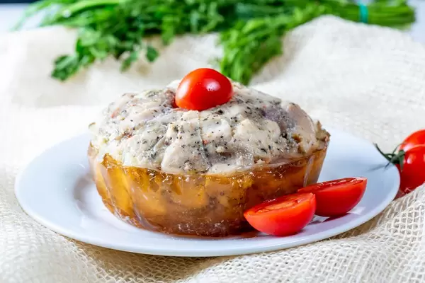 Jellied ham with tomato on the burlap background