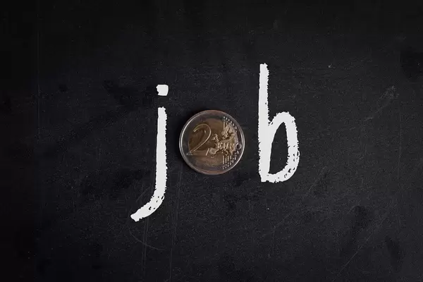 Job text with 2 Euro coin