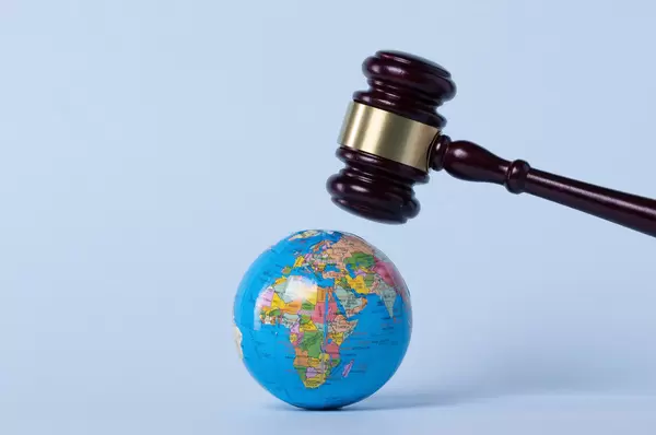 Judge gavel over a globe