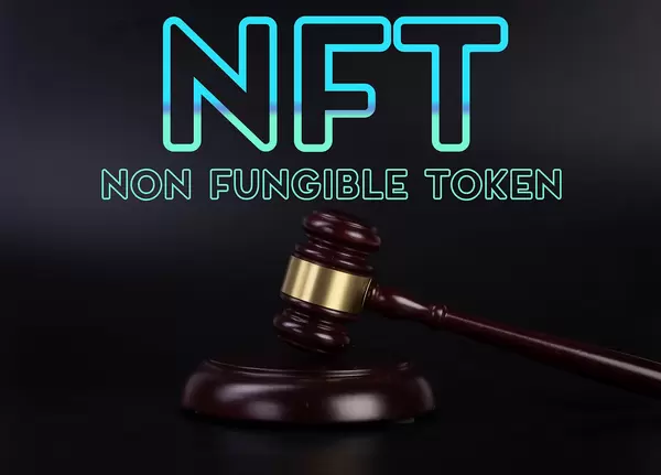 Judge gavel with NFT Non Fungible Token text on black background