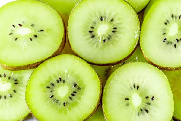 Juicy ripe slices of kiwi background