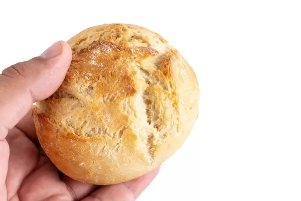 Kaiser Bun in the hand above white background