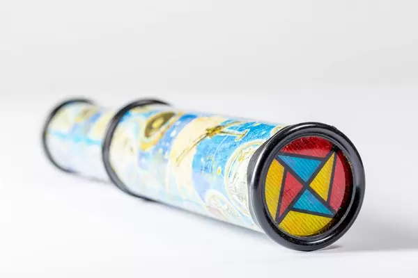 Kaleidoscope with colored glasses on white background