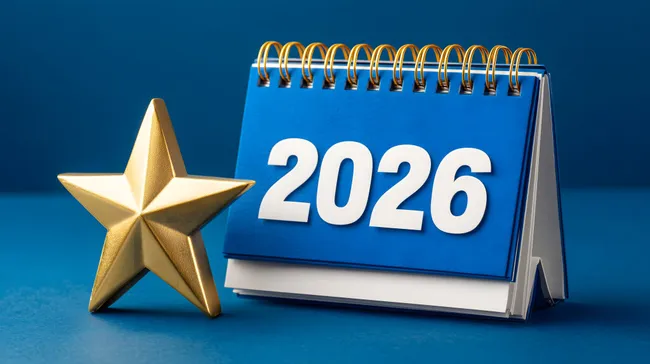 Kalender 2026 mit goldenem Stern auf blauem Hintergrund