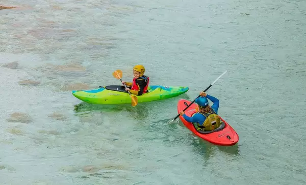 Kayakers on the famous turquoise Soca river, Bovec, Slovenia