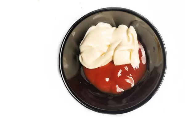 Ketchup and Mayonnaise sauce in the black bowl