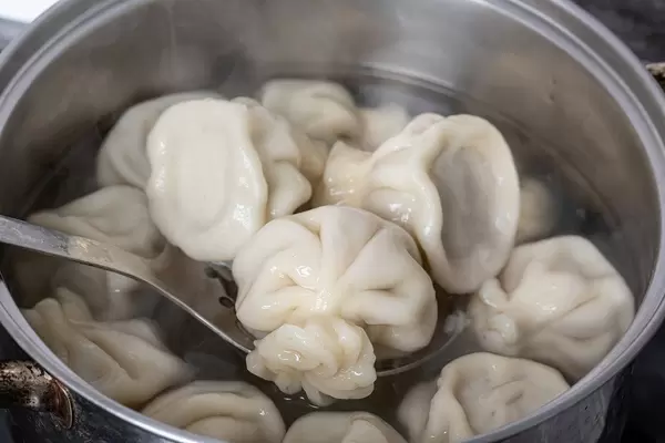 Khinkali is cooked in an iron pot