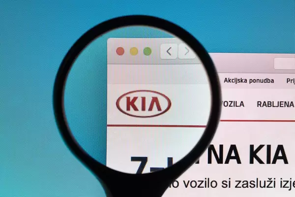 KIA logo under magnifying glass