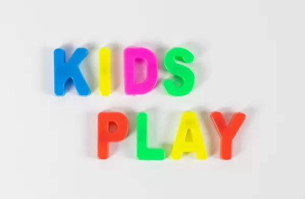 Kids play written with colorful letters