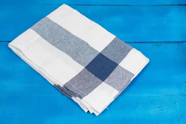 Kitchen Dishcloth in blue and white color on the wooden table (Flip 2020)