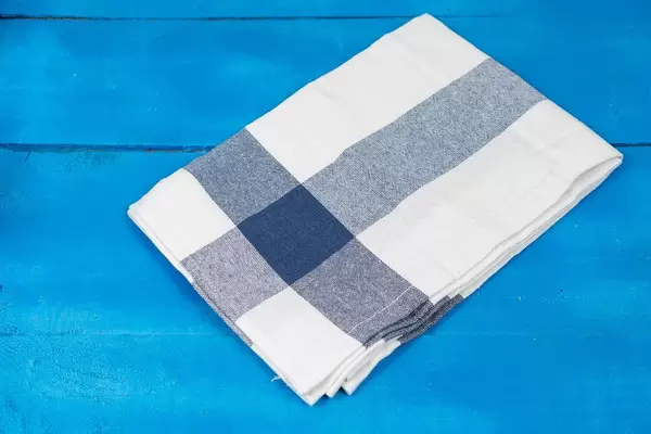 Kitchen-Dishcloth-in-blue-and-white-color-on-the-wooden-table.jpg