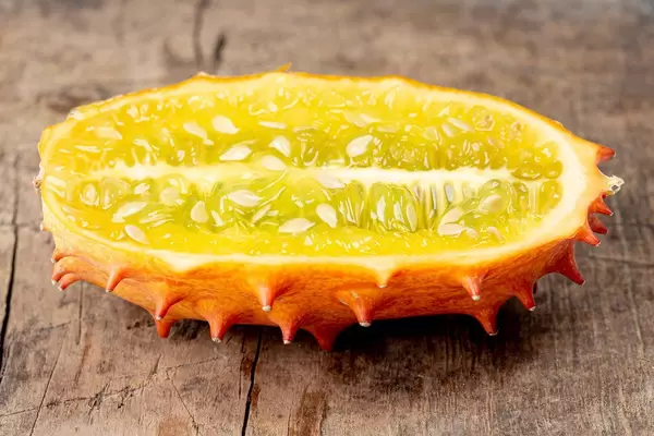 Kiwano fruit half on old wooden background (Flip 2020)
