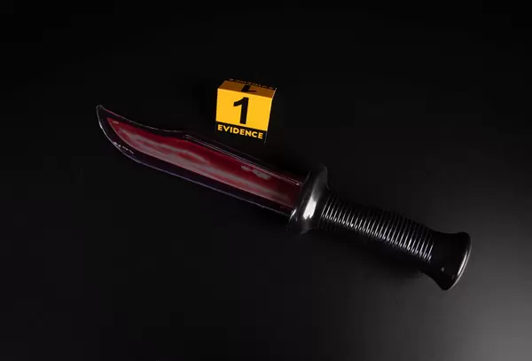 Knife with grungy blood mark, crime murder and violation concept