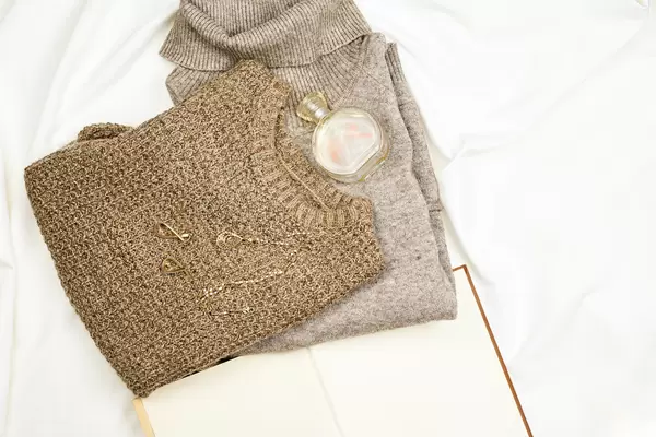 Knitted winter sweaters with perfume and jewelry